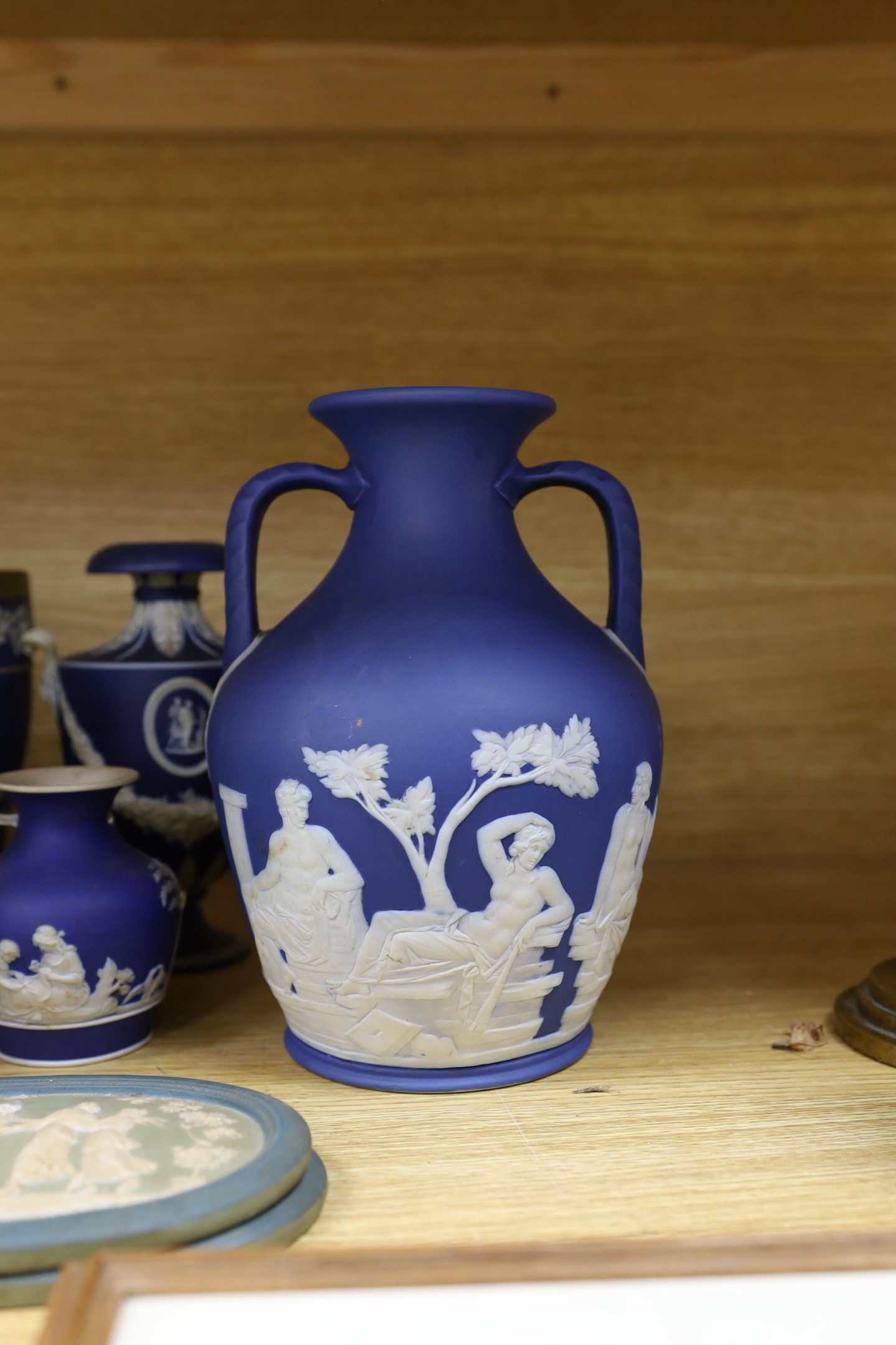 A collection of Victorian and later Jasperware, including a 19th century Wedgwood version of the Portland vase, 23 cms high